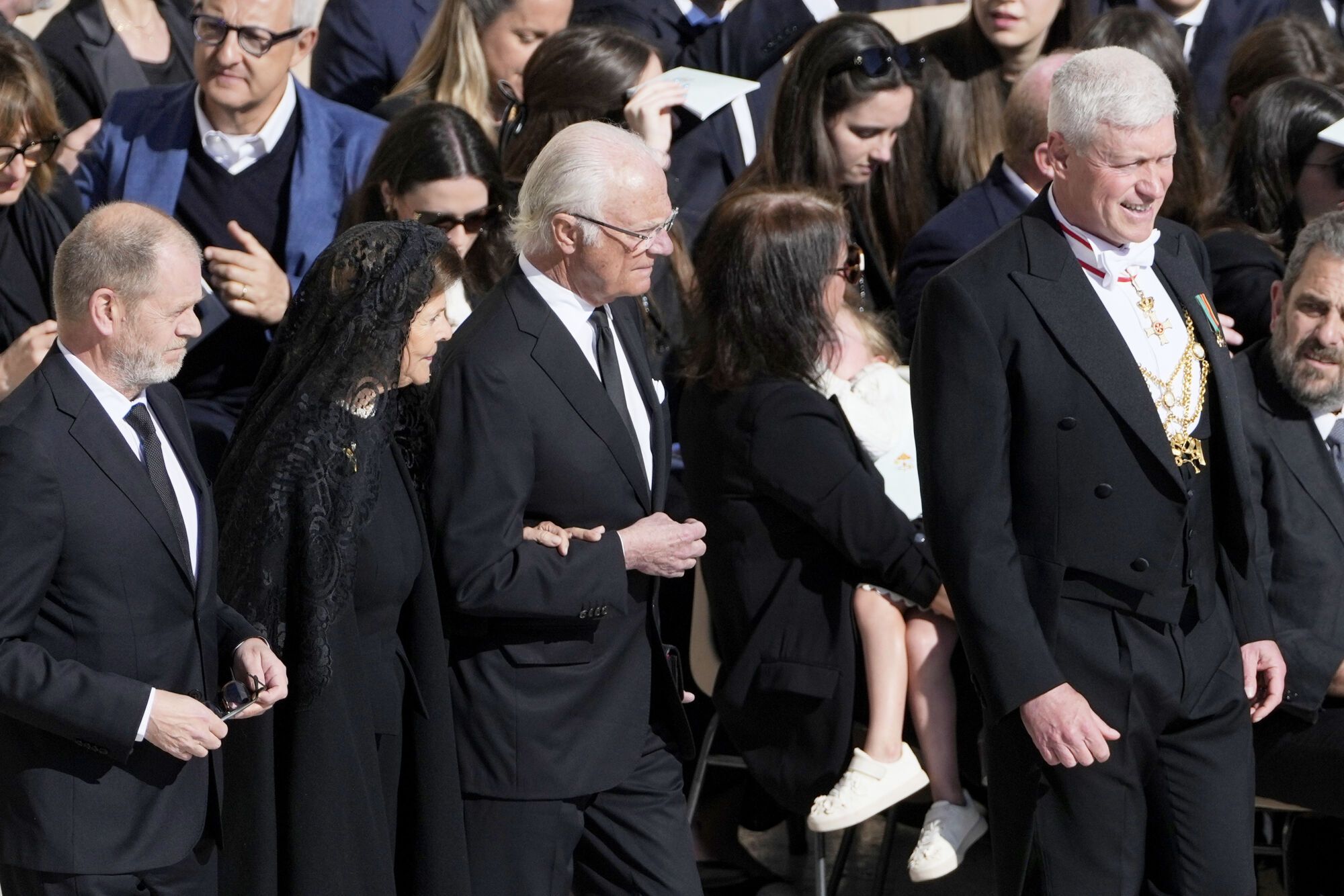 Sweden's King Carl XVI Gustaf, center, and Sweden's Queen Silvia, second left, arrive for the funeral of Pope Francis in St. Peter's Square at the Vatican, Saturday, April 26, 2025. (AP Photo/Markus Schreiber). EDITORIAL USE ONLY/ONLY ITALY AND SPAIN