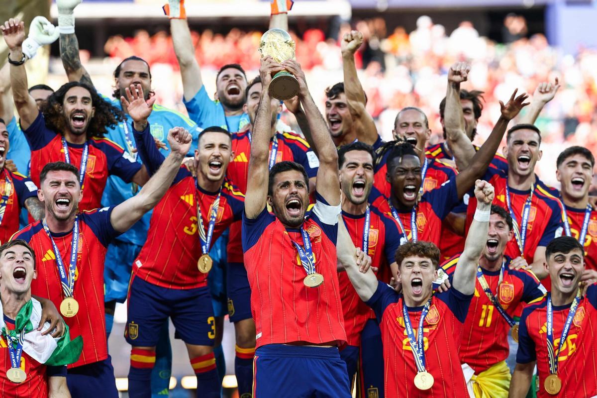 Spain's midfielder #16 Rodri lifts the trophy with his teammates after winning the 2026 World Cup football tournament final match between Spain and Argentina at the New York/New Jersey Stadium in East Rutherford on July 19, 2026. (Photo by FRANCK FIFE / AFP)