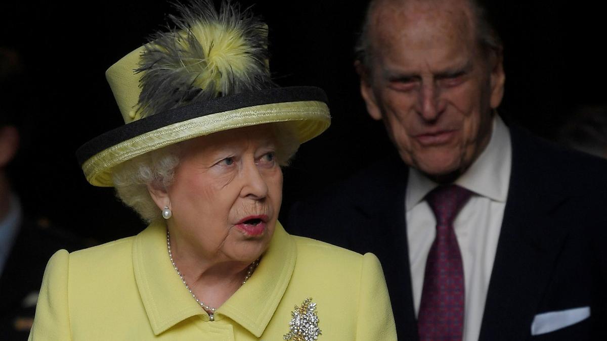 Britain's Queen Elizabeth leaves with her husband Prince Philip following a Commonwealth Day service at Westminster Abbey in London