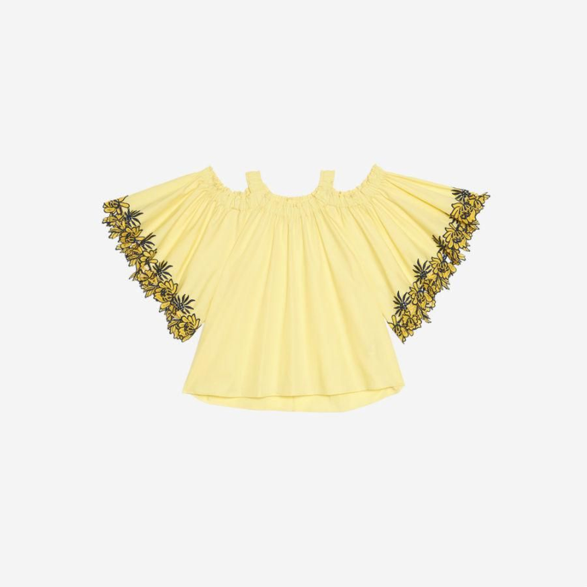 Prendas y complementos en amarillo:  top de Sandro