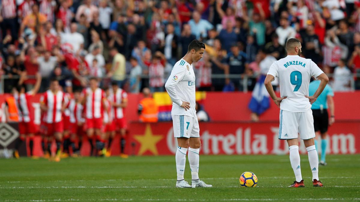 Real Madrid’s Cristiano Ronaldo and Karim Benzema lookdejected after Girona scored