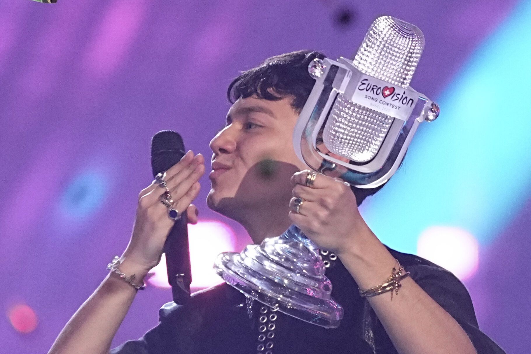 Winner of the Eurovision Song Contest JJ from Austria holds up the trophy and blows a kiss to the audience, he won with the song "Wasted Love" during the Grand Final of the 69th Eurovision Song Contest, in Basel, Switzerland, Saturday, May 17, 2025. (AP Photo/Martin Meissner)