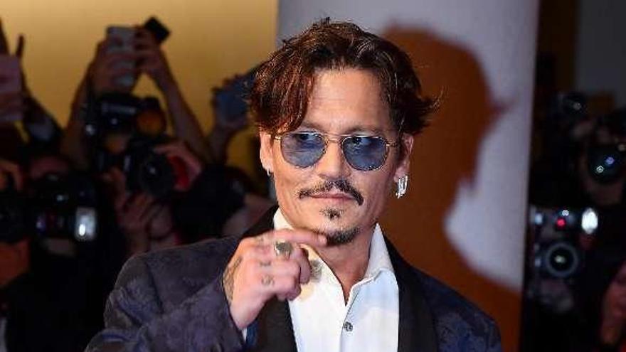 Johnny Depp llega al festival. // Efe