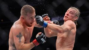 Justin Gaethje, left, and Paddy Pimblett battle in an interim lightweight title fight during the UFC 324 mixed martial arts event Saturday Jan. 24, 2026, in Las Vegas. (AP Photo/Steve Marcus)