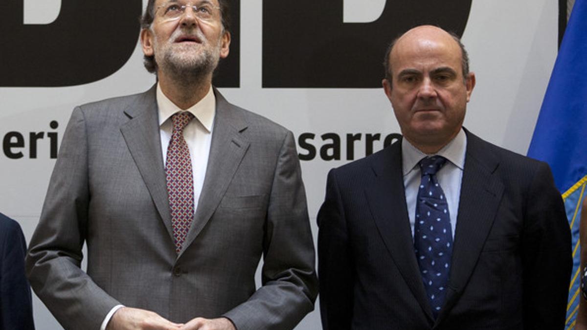 Mariano Rajoy y Luis de Guindos, el pasado julio, en un acto en Madrid.