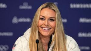 United States Lindsey Vonn smiles during a press conference by the U.S. ski team at the 2026 Winter Olympics, in Cortina dAmpezzo, Italy, Tuesday, Feb. 3, 2026. (AP Photo/Fatima Shbair)