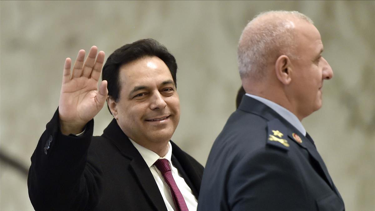 Baabda (Lebanon)  22 01 2020 - (FILE) - Lebanese Prime Minister Hassan Diab waves upon arrival to attend the first session of the new Council of Ministers at the Presidential Palace in Baabda  east of Beirut  Lebanon  22 January 2020 (reissued 10 December 2020)  Lebanese prosecutor probing port explosion in Beirut filed charges against outgoing Prime Minister Diab  and three former ministers  All four were charged with negligence leading to deaths over the 04 August explosion at Beirut port  in which at least 200 people were killed and more than 6 000 were injured when a massive blast  believed to have been caused by an estimated 2 750 tons of ammonium nitrate stored in a warehouse  devastated the port area of Beirut and several parts of the city  (Libano) EFE EPA WAEL HAMZEH