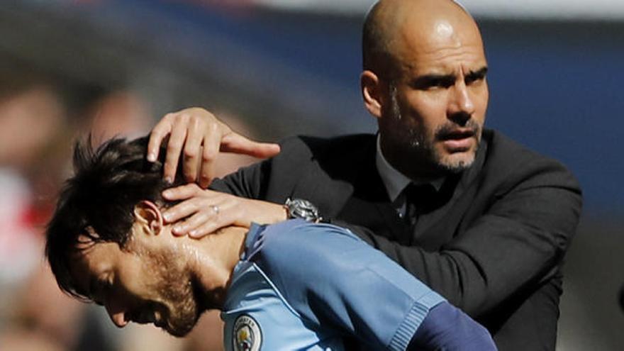 Guardiola y David Silva.