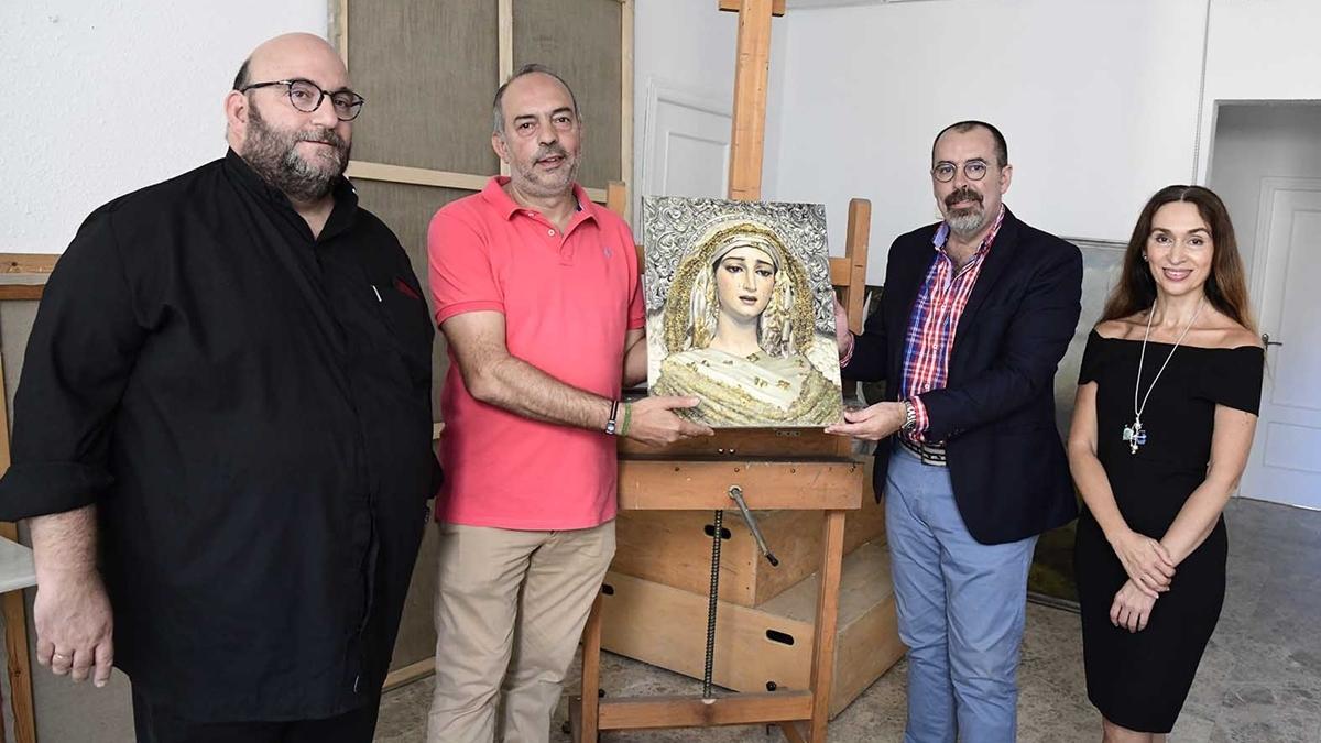 Aurelio González, segundo por la derecha, junto a la pintora María José Ruiz.