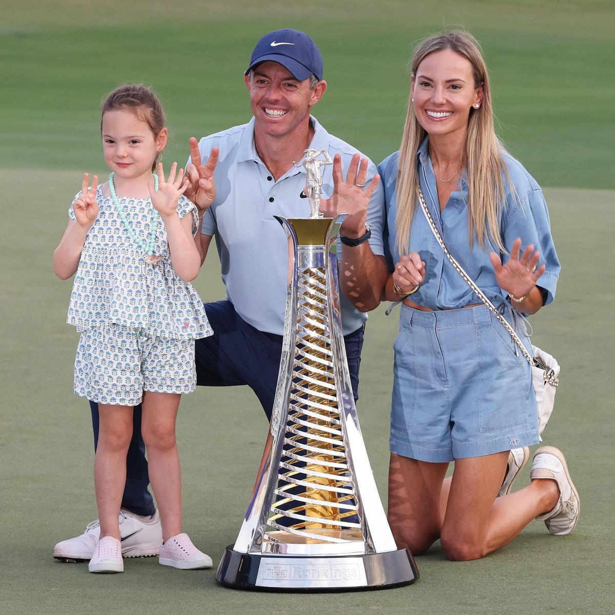 McIlroy celebrates with his wife and daughter his seventh crown as best player of the season on the DP World Tour