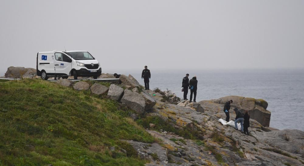 Hallado un cadáver en unas rocas junto al Milleniu