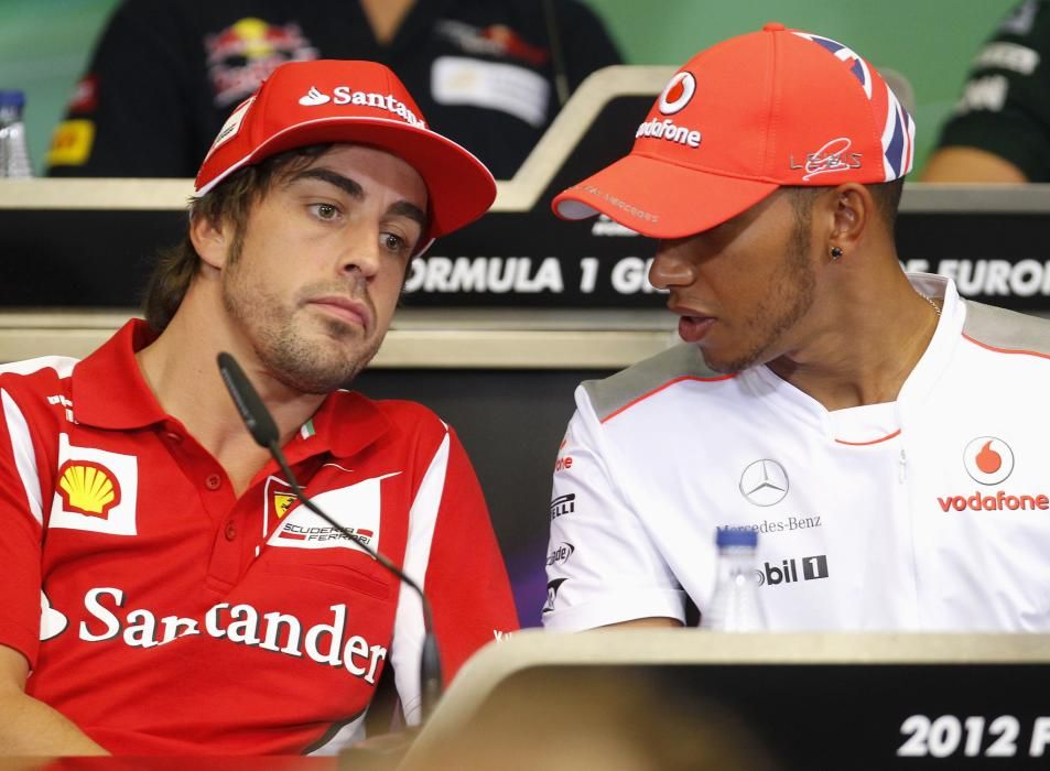 Hamilton of Britain talks to Alonso of Spain ...