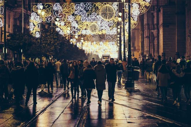 Tourists and people walking at christmas night