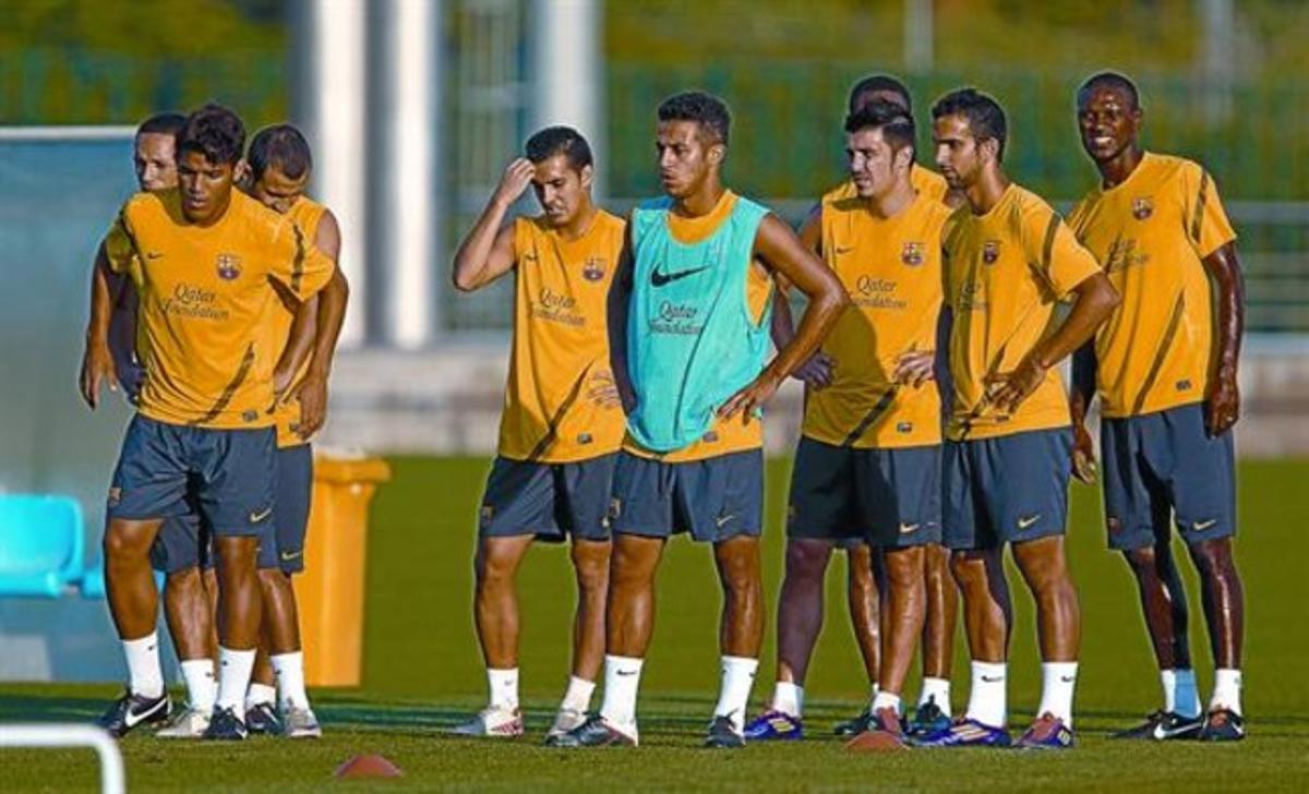 Dos Santos i Thiago, juntament amb altres companys, en l’entrenament d’ahir a les instal·lacions de Sant Joan Despí. Dos Santos i Thiago, juntament amb altres companys, en l’entrenament d’ahir a les instal·lacions de Sant Joan Despí.
