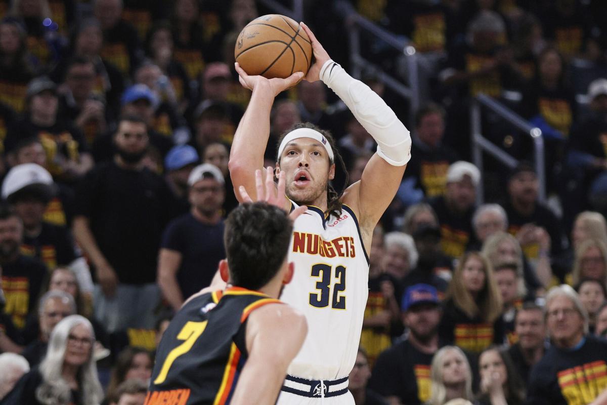 Denver Nuggets forward Aaron Gordon (32) shoots as Oklahoma City Thunder's Chet Holmgren (7) defends in the first half of Game 1 of an NBA basketball second-round playoff series Monday, May 5, 2025, in Oklahoma City. (AP Photo/Nate Billings)