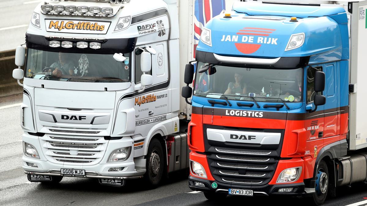 Lorries drive on the M1 motorway amid a fuel shortage, in Luton