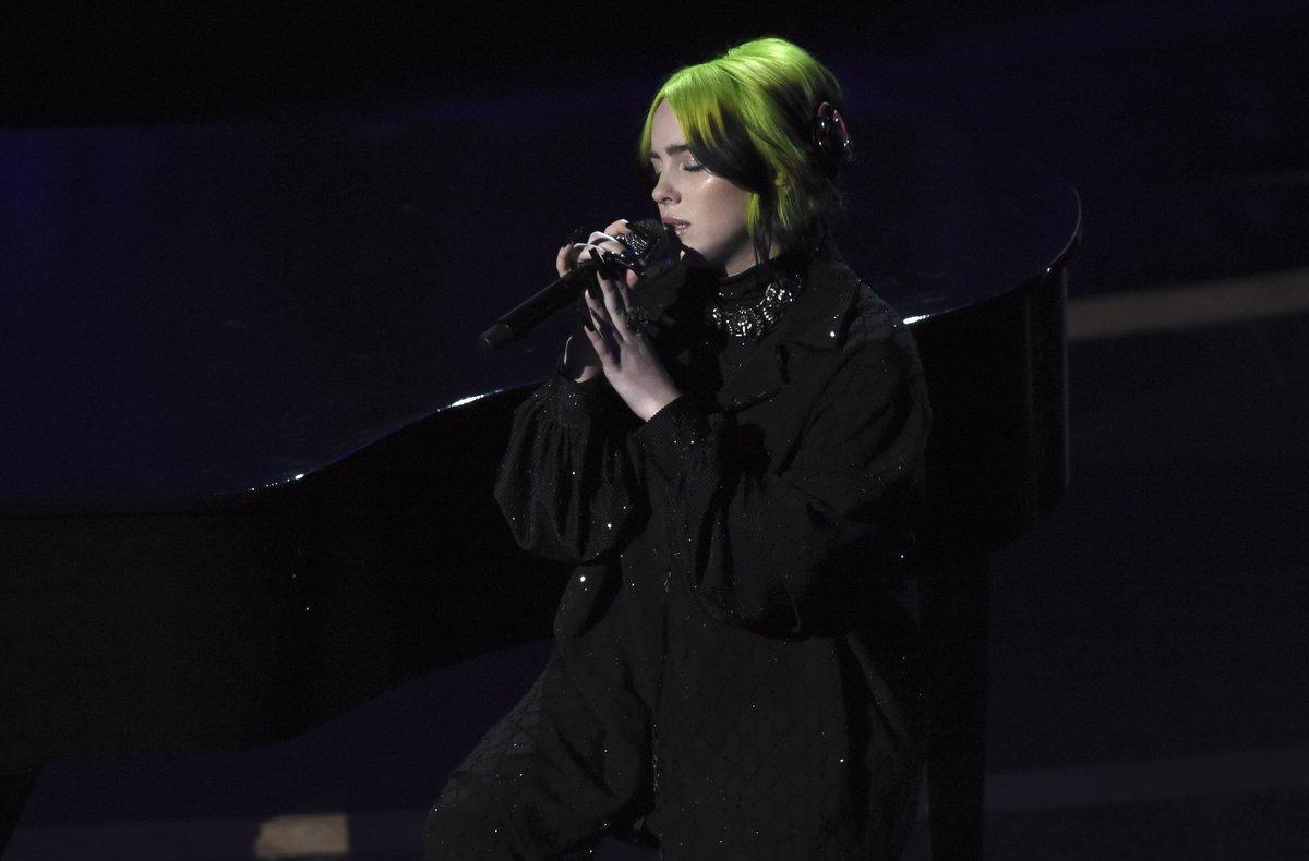 Billie Eilish performs during the in memoriam tribute at the Oscars on Sunday, Feb. 9, 2020, at the Dolby Theatre in Los Angeles. (AP Photo/Chris Pizzello)