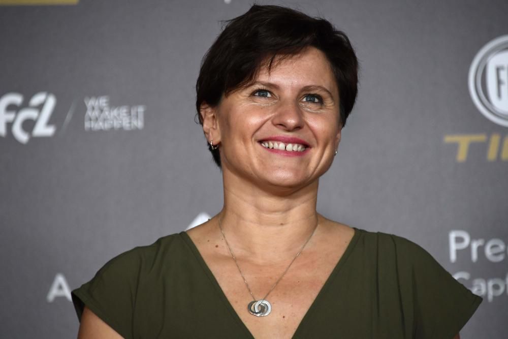 French Sports Minister Roxana Maracineanu poses upon arrival at the 2018 FIFA Ballon d'Or award ceremony at the Grand Palais in Paris on December 3, 2018. - The winner of the 2018 Ballon d'Or will be revealed at a glittering ceremony in Paris on December 3 evening, with Croatia's Luka Modric and a host of French World Cup winners all hoping to finally end the 10-year duopoly of Cristiano Ronaldo and Lionel Messi. (Photo by Anne-Christine POUJOULAT / AFP)