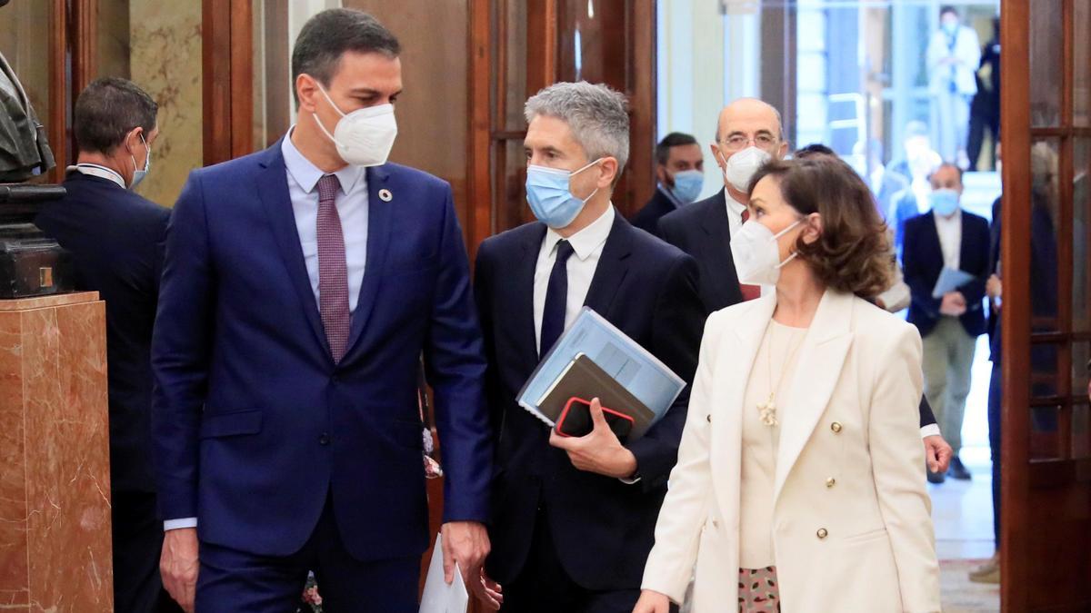 Pedro Sánchez, Fernando Grande-Marlaska y Carmen Calvo.