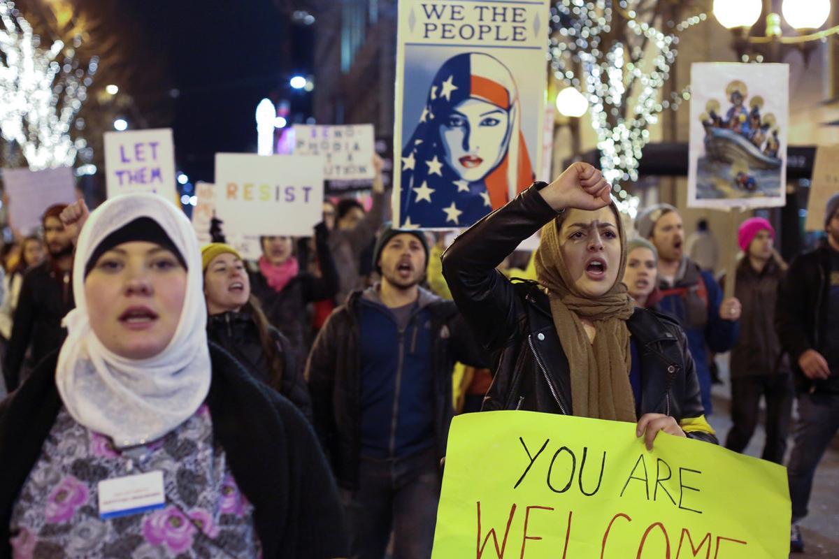 People march through downtown Seattle during a protest held in response to President Donald Trump’s travel ban, in Seattle, Washington, U.S. January 29, 2017.  REUTERS/David Ryder