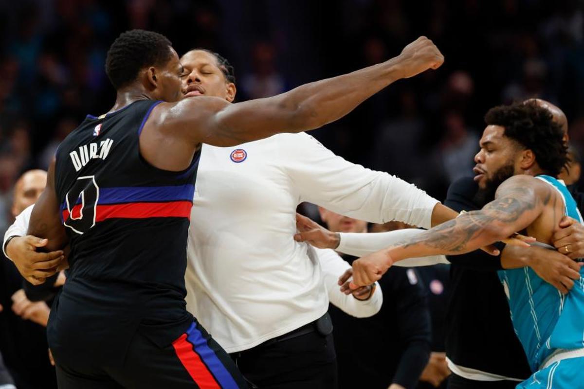Charlotte Hornets forward Moussa Diabate, second from left, is held back as he goes after Detroit Pistons center Jalen Duren during a fight on the court in the second half of an NBA basketball game in Charlotte, N.C., Monday, Feb. 9, 2026. (AP Photo/Nell Redmond)