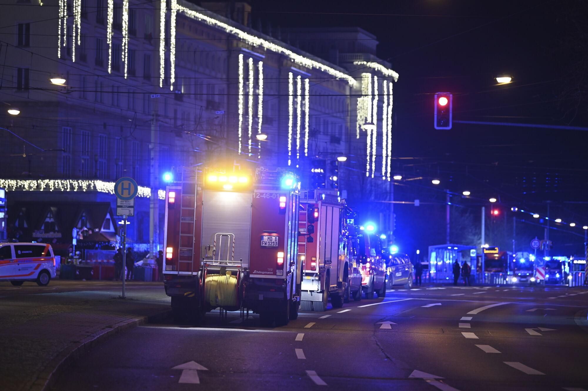 Emergency services attend an incident at the Christmas market in Magdeburg, Germany, Friday Dec. 20, 2024. (Heiko Rebsch/dpa via AP). GERMANY OUT; MANDATORY CREDIT