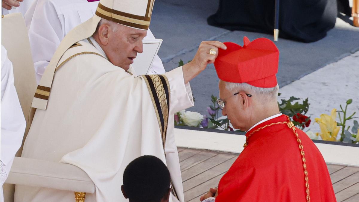FILE - Newly elected Cardinal Robert Francis Prevost, Prefect of the Dicastery for Bishops, right, receives his biretta from Pope Francis as he is elevated in St. Peter's Square at The Vatican, Sept. 30, 2023. (AP Photo/Riccardo De Luca, file). FILE