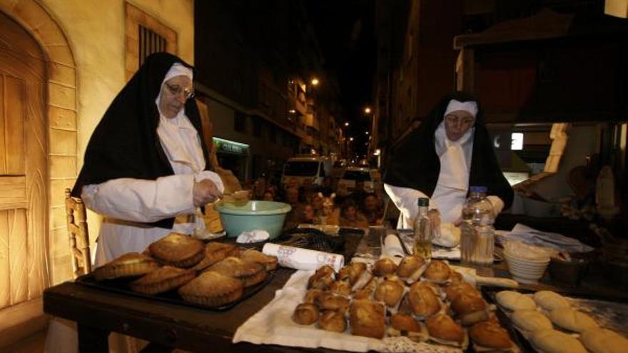 Dos monjas elaborando dulces.