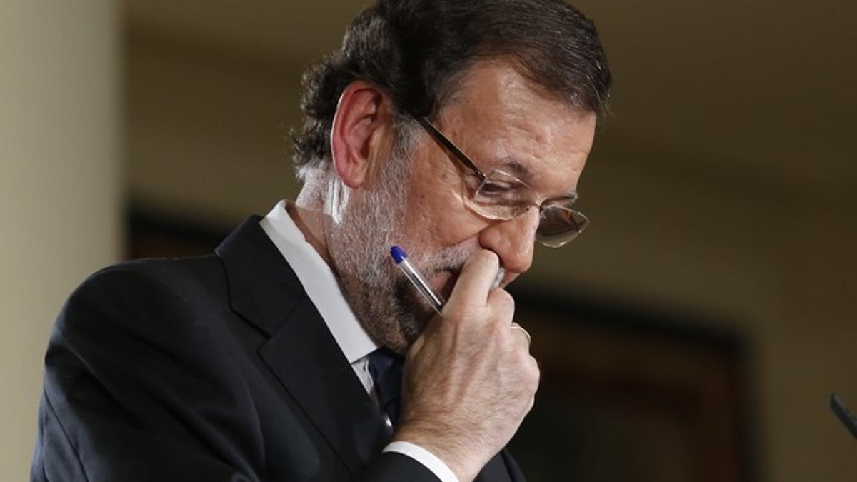 El presidente del Gobierno, Mariano Rajoy, durante la rueda de prensa tras el último Consejo de Ministros del año, en la que ha hecho balance del 2014.