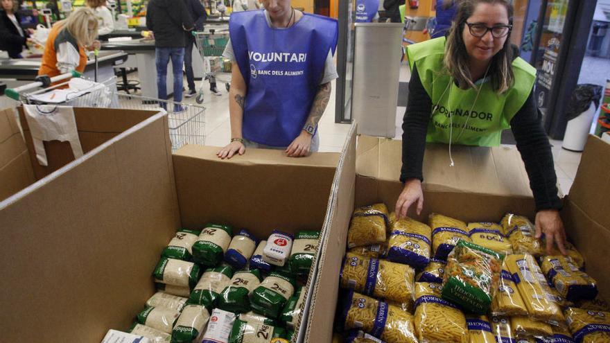 Un dels supermercats i dues de les voluntàries de l&#039;últim Gran Recapte a Girona