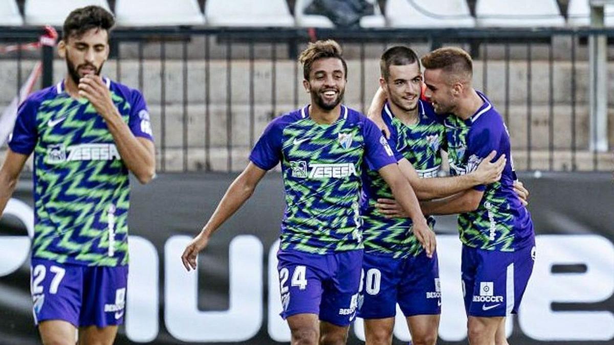 Ramón e Ismael Casas, con Benkhemassa y Juande, en primer plano, celebran un tanto.