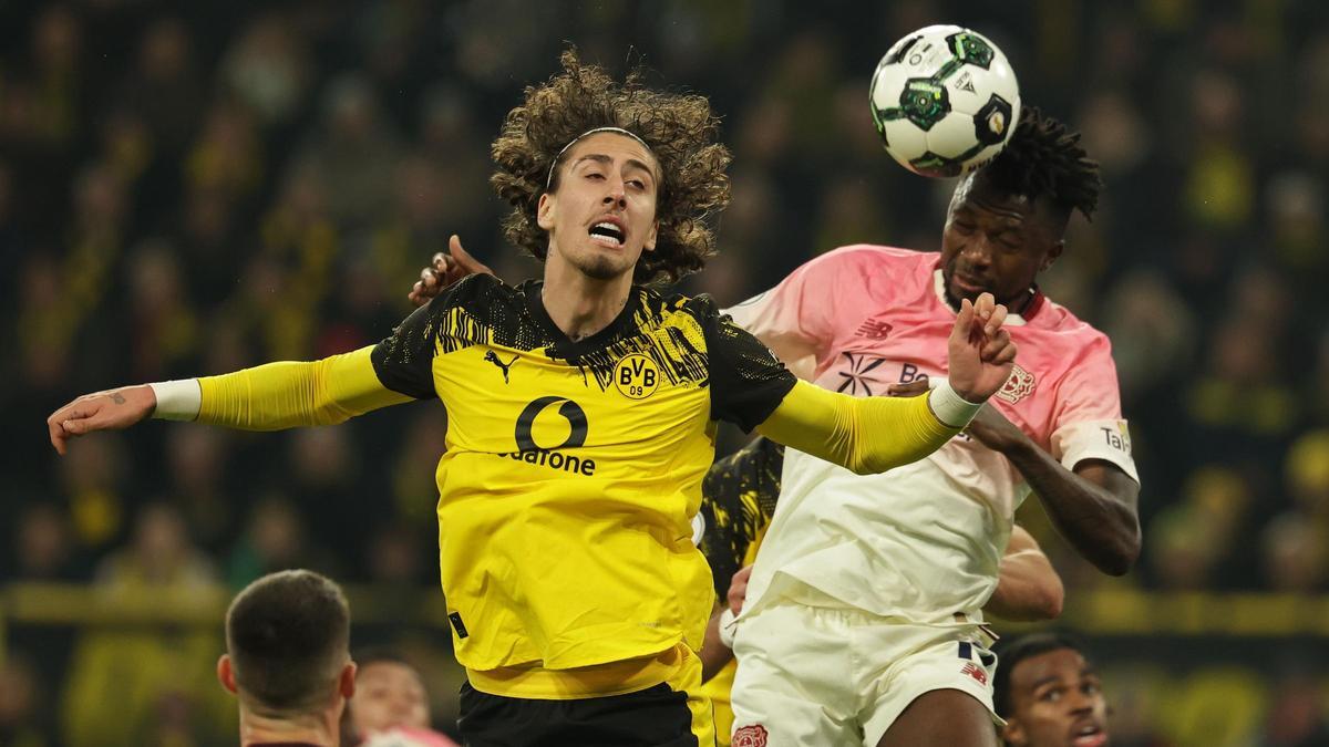 Dortmund (Germany), 02/12/2025.- Fabio Silva of Dortmund (L) in action against Edmond Tapsoba of Leverkusen (R) during the DFB Cup round of sixteen match between Borussia Dortmund vs Bayer 04 Leverkusen, in Dortmund, Germany, 02 December 2025. (Alemania) EFE/EPA/Friedemann Vogel The DFB regulations prohibit any use of photographs as image sequences and/or quasi-video.