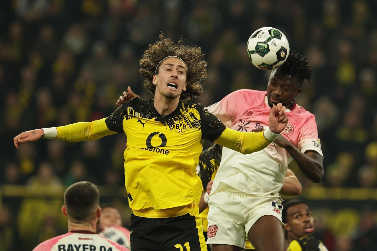 Dortmund (Germany), 02/12/2025.- Fabio Silva of Dortmund (L) in action against Edmond Tapsoba of Leverkusen (R) during the DFB Cup round of sixteen match between Borussia Dortmund vs Bayer 04 Leverkusen, in Dortmund, Germany, 02 December 2025. (Alemania) EFE/EPA/Friedemann Vogel The DFB regulations prohibit any use of photographs as image sequences and/or quasi-video.