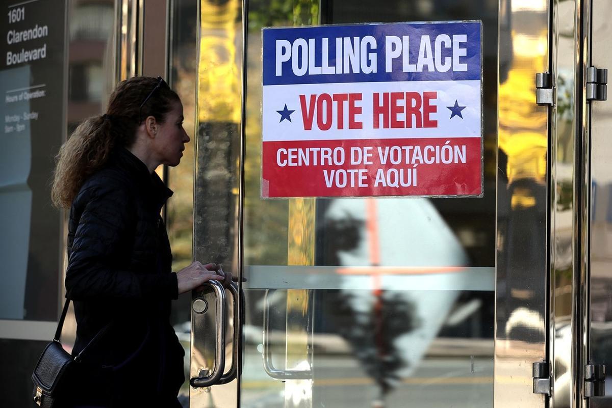 ARLINGTON, VA - NOVEMBER 08: A voter enters a polling place on Election Day November 8, 2016 in Arlington, Virginia. Americans across the nation pick their choice for the next president of the United States.   Alex Wong/Getty Images/AFP