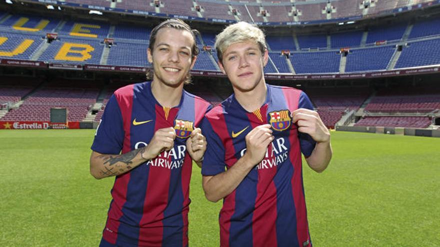 Luis Tomlinson y Niall Horan visitando el Camp Nou.