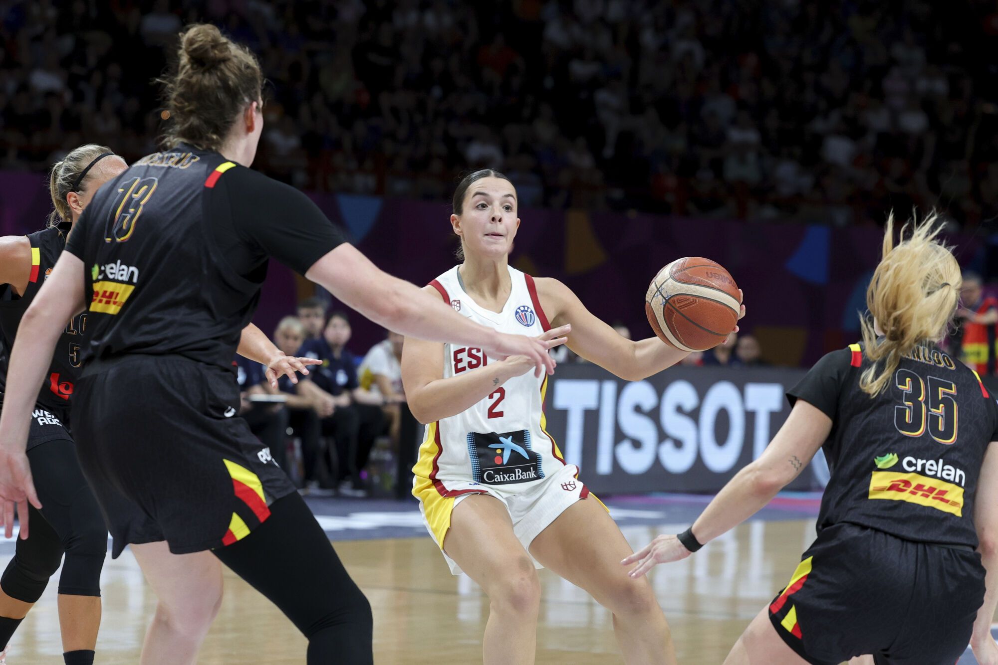 Spain's Elena Buenavida, centre, controls the ball during the FIBA Women's EuroBasket 2025 final match between Spain and Belgium at the Peace and Friendship Stadium in Piraeus near Athens, Greece, Sunday, June 29, 2025. (AP Photo/Yorgos Karahalis). EDITORIAL USE ONLY/ONLY ITALY AND SPAIN