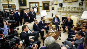 Friedrich Merz, Germanys chancellor, center left, and US President Donald Trump during a meeting in the Oval Office of the White House in Washington, DC, US, on Tuesday, March 3, 2026. Merz said he intended to discuss with President Donald Trump the next steps in the war on Iran amid questions about the US administrations endgame after it launched strikes on the Islamic Republic. Photographer: Samuel Corum/Sipa/Bloomberg