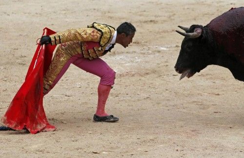 French bullfighter Savalli taunts a bull in the arena during the traditional Easter Feria in Arles