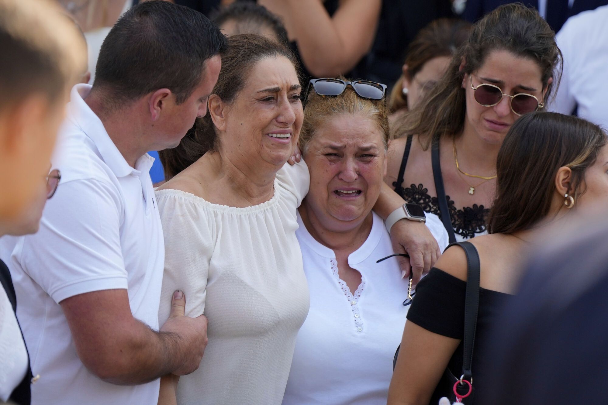 Mourners react as the coffins of Diogo Jota and his brother André Silva are carried outside the church during their funeral in Gondomar, near Porto, Portugal, on Saturday, July 5, 2025. (AP Photo/Manu Fernandez)