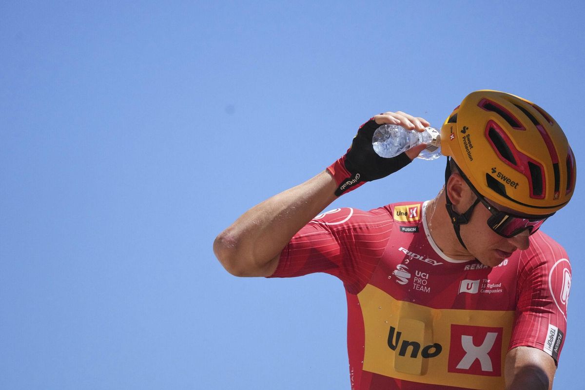 Norways Jonas Abrahamsen cools off before the twelfth stage of the Tour de France cycling race over 180.6 kilometers (112.2 miles) with start in Auch and finish in Hautacam, France, Thursday, July 17, 2025. (AP Photo/Thibault Camus)
