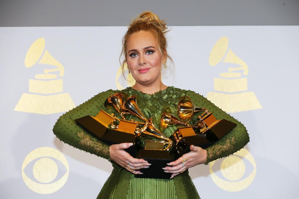 Adele holds her five Grammys during the 59th ...