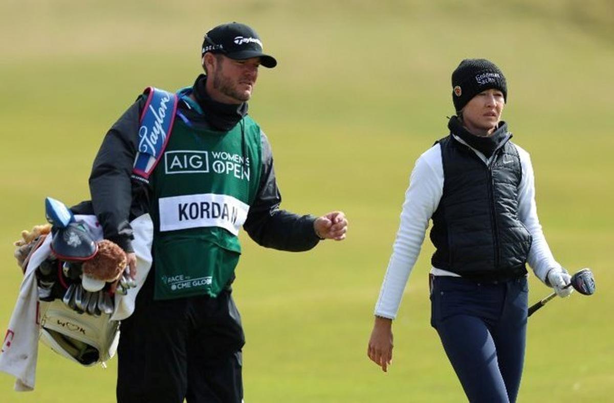 Nelly Korda chats with her caddie during the third round at St. Andrews