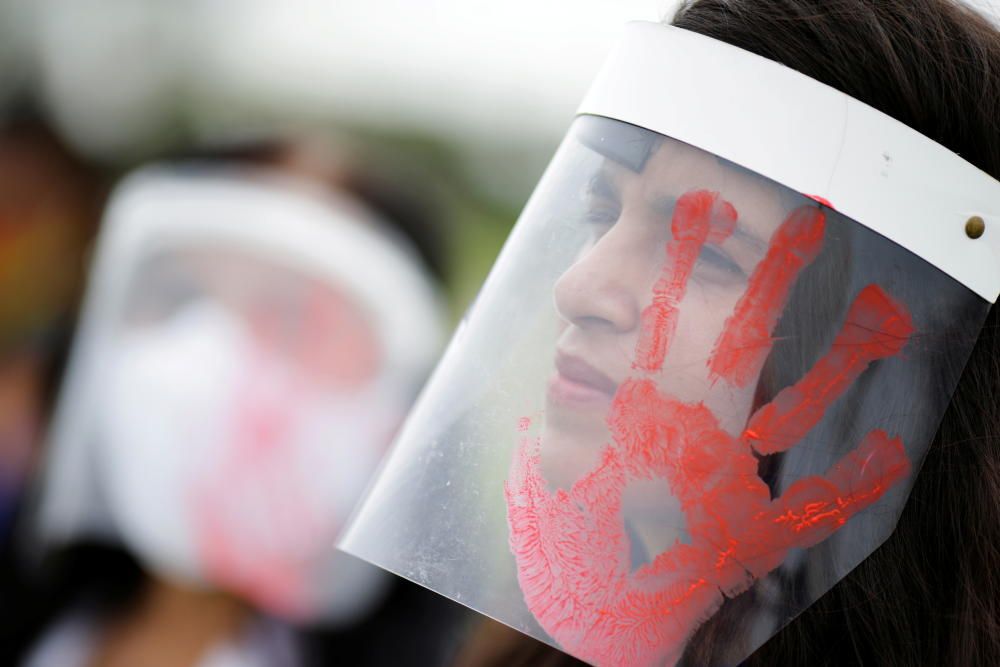 A demonstrator takes part in a protest asking ...