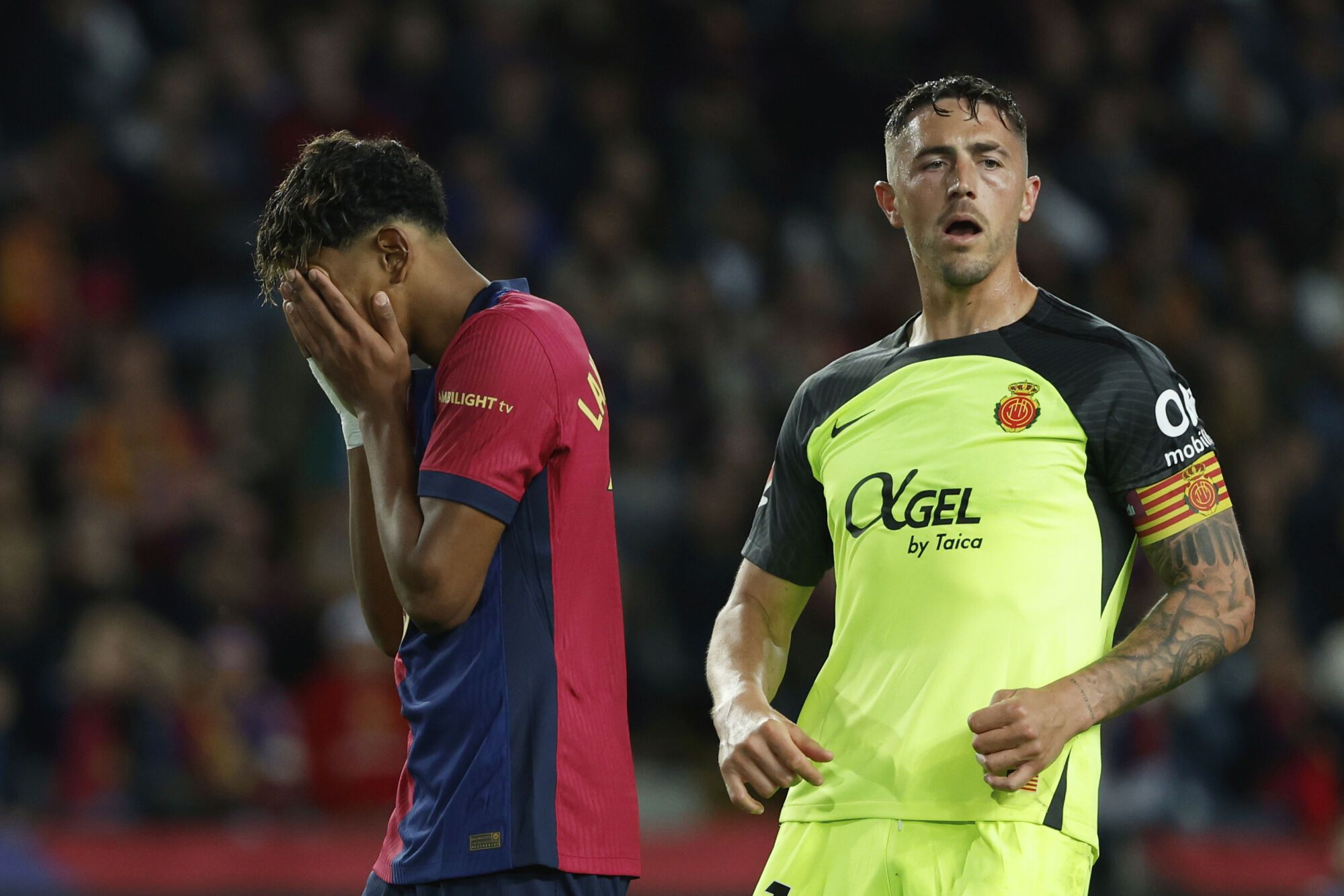 Barcelona's Lamine Yamal reacts after missing a scoring chance during a Spanish La Liga soccer match between Barcelona and Mallorca at the Lluis Companys Olympic stadium in Barcelona, Spain, Tuesday, April 22, 2025. (AP Photo/Joan Monfort). EDITORIAL USE ONLY/ONLY ITALY AND SPAIN