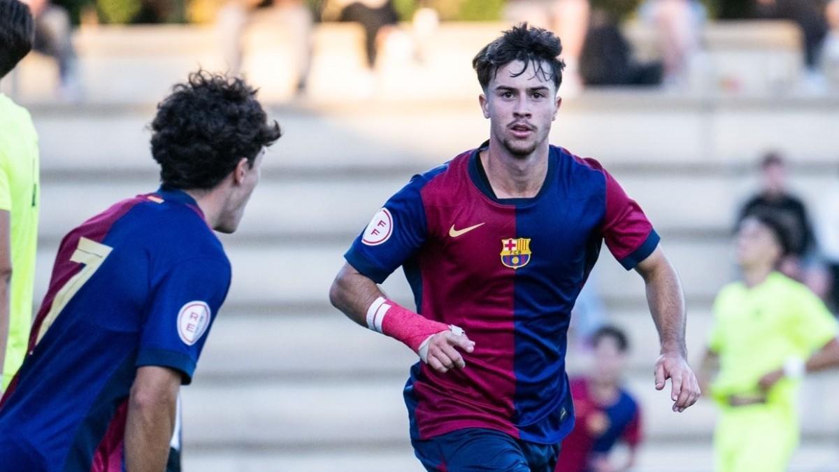 Hugo celebra un gol con Jan Virgili