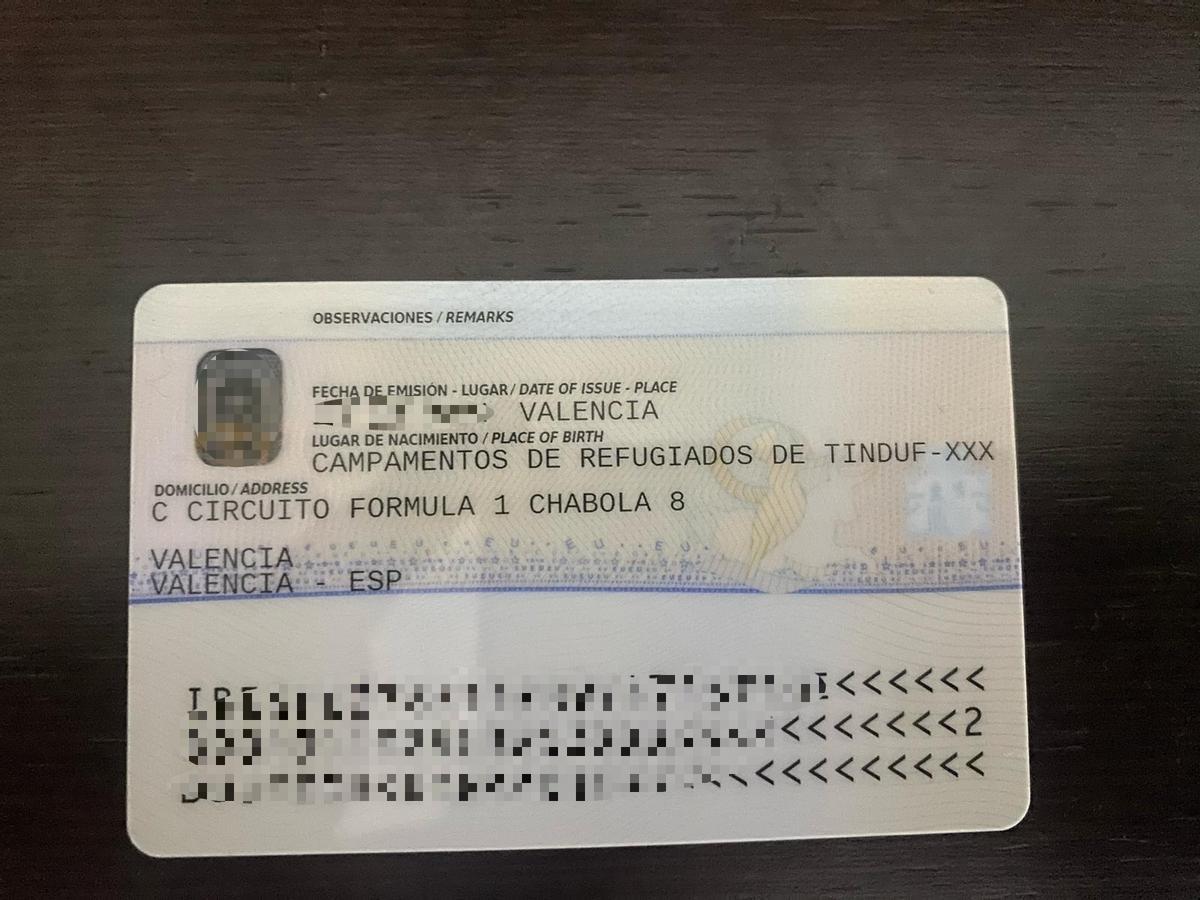 Un TIE (Tarjeta de Identidad de Extranjero) con dirección en el asentamiento