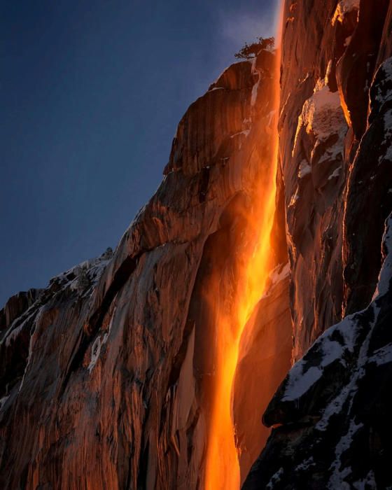 Sunlight hits the Horsetail Fall, turning it ...