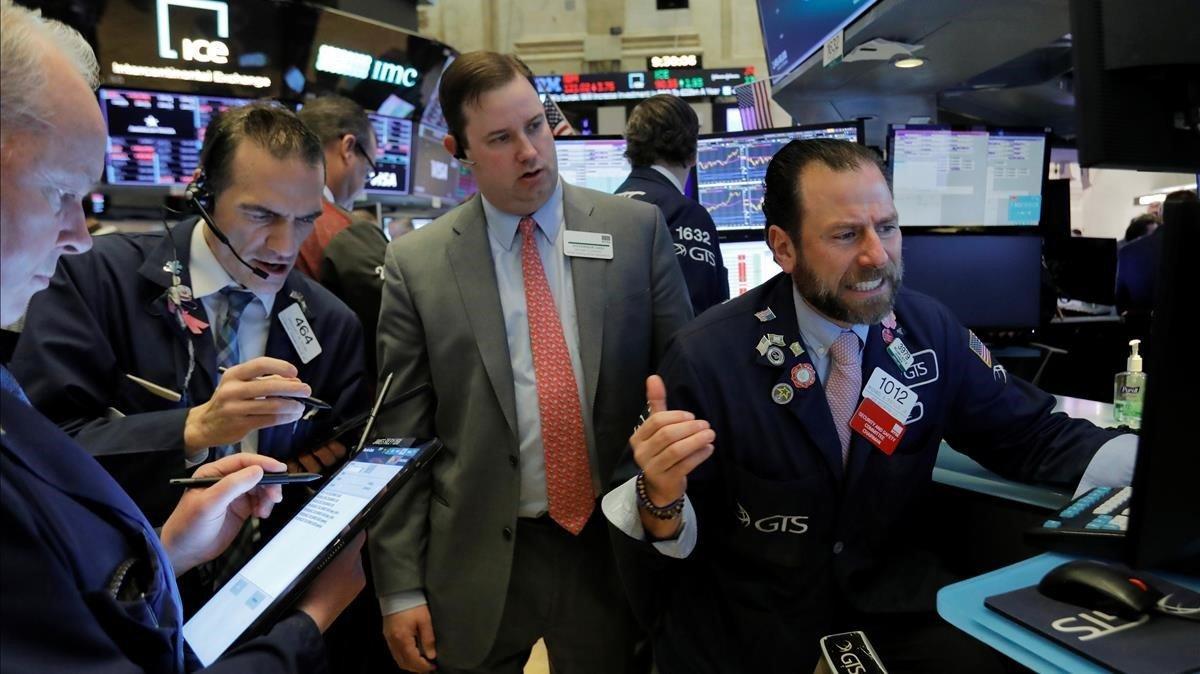 Operadores del mercado de Nueva York, en la apertura de este miércoles. Operadores del mercado de Nueva York, en la apertura de este miércoles.