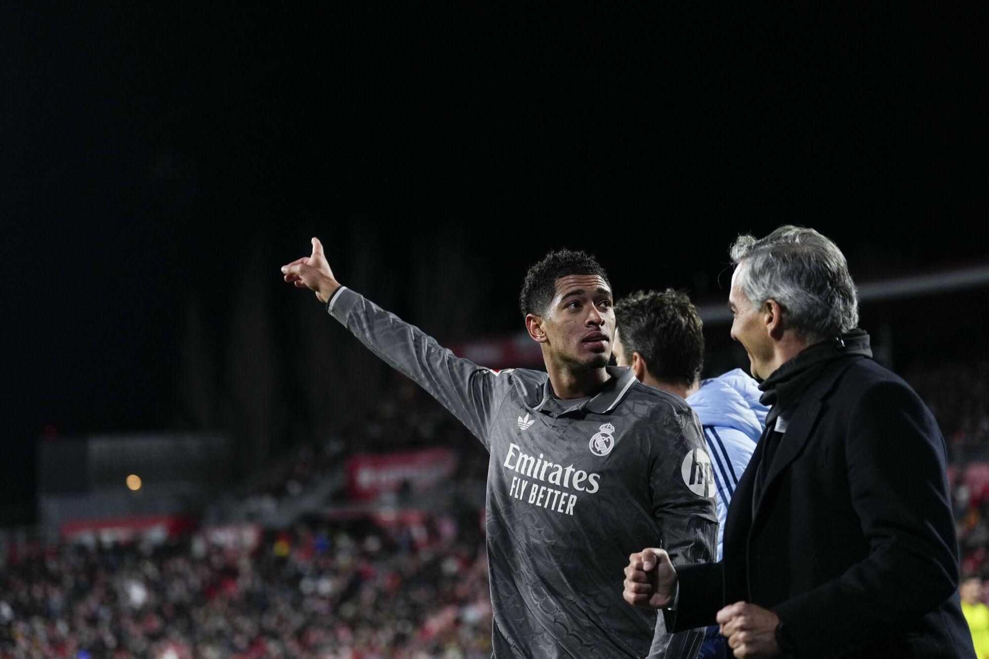 Real Madrid's Jude Bellingham (L) celebrates the 0-3 goal during the Spanish LaLiga soccer match between Girona FC and Real Madrid, in Girona, Spain, 07 December 2024. EFE/ Alejandro Garcia