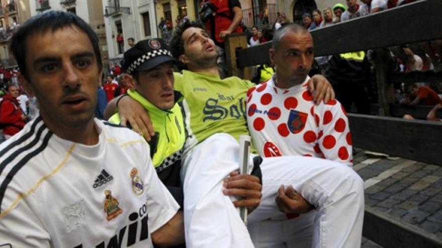 El séptimo encierro de San Fermín deja dos heridos por asta de toro